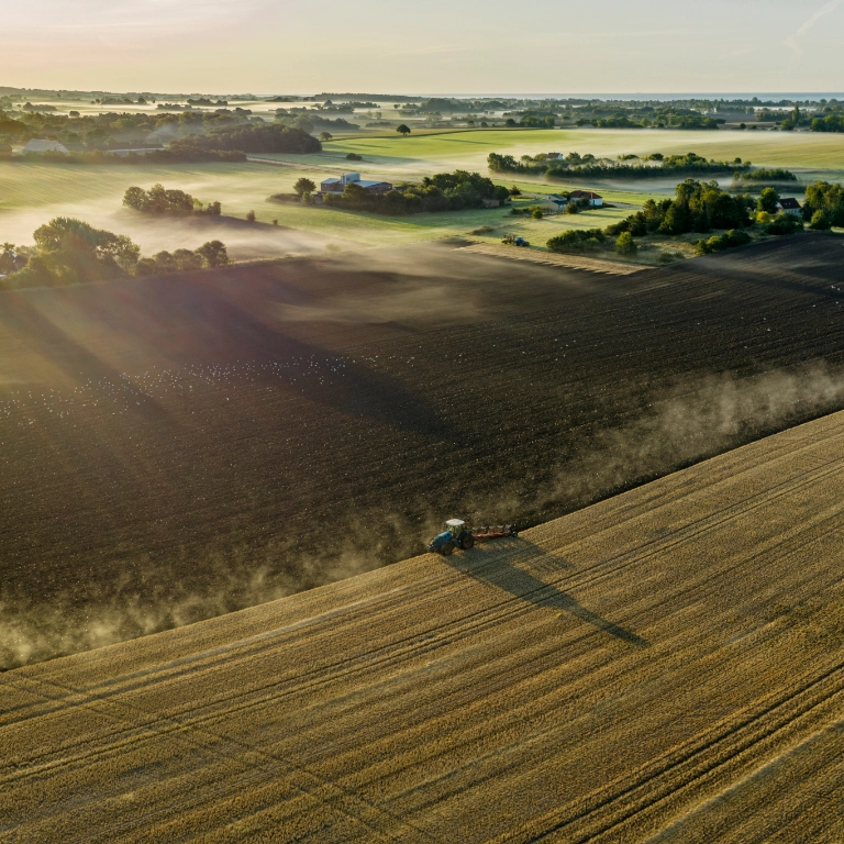Tractor ploughing a rural field