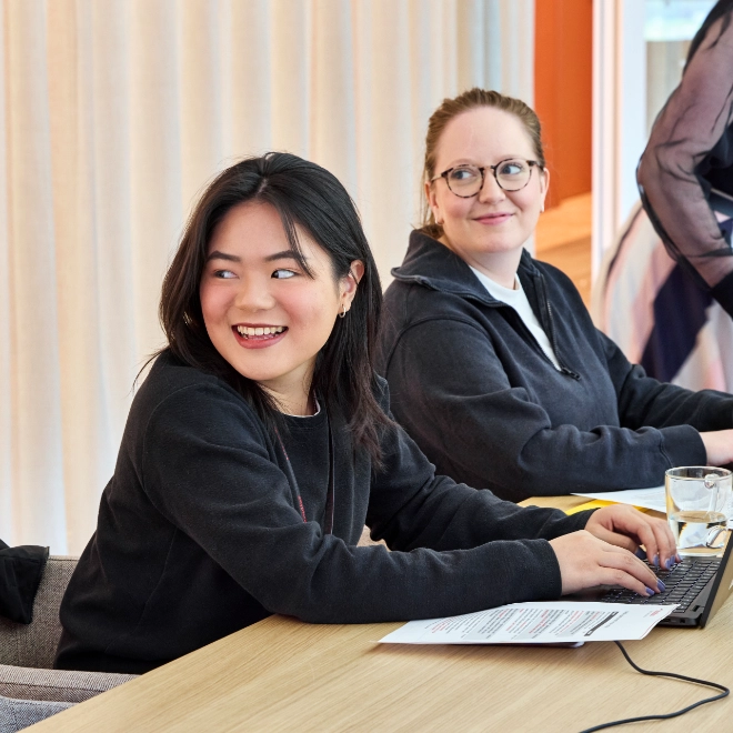 Something draws the attention of women participating in the workshop